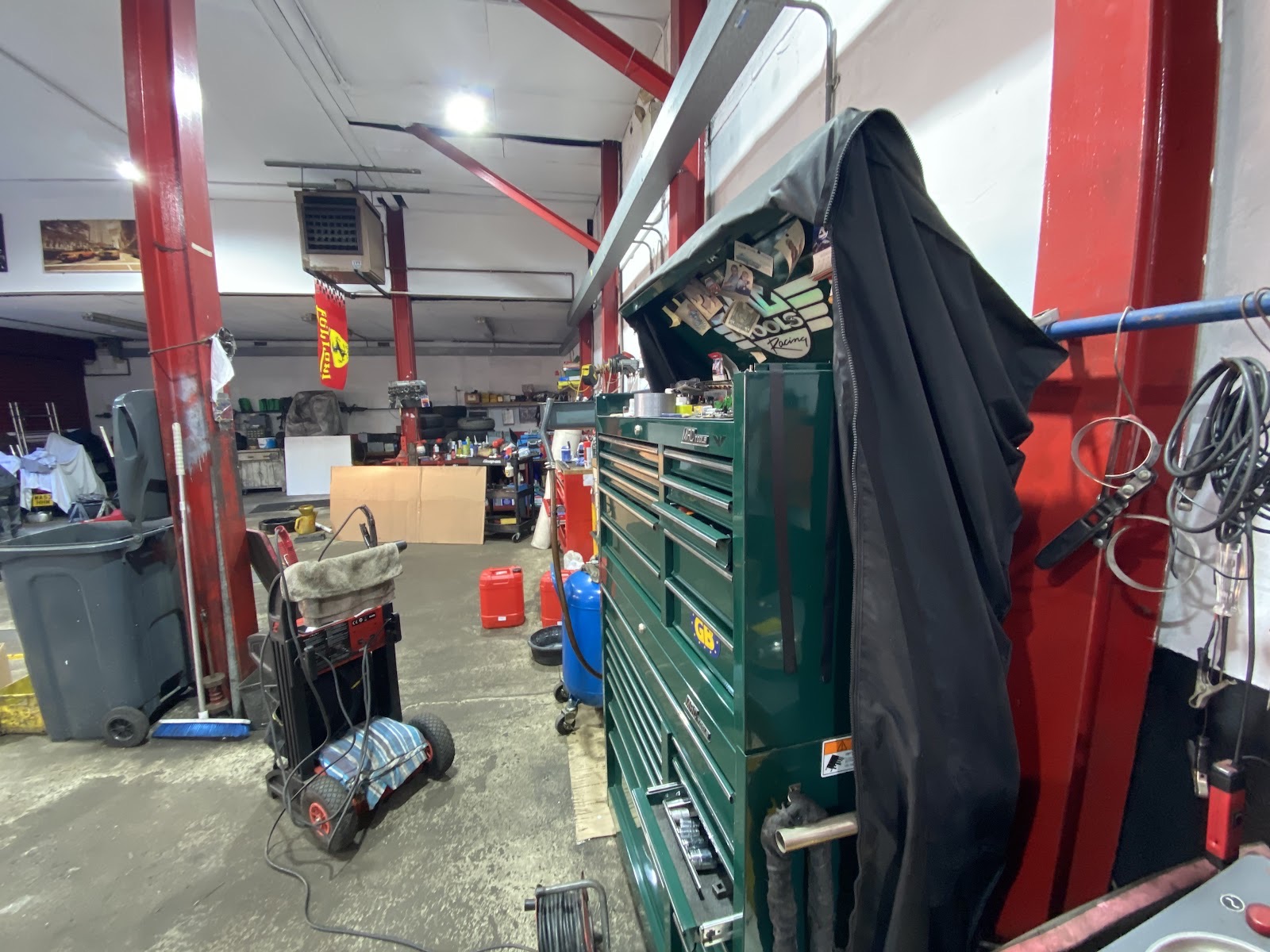 The Mayday MOT and Service Centre shopfront on A Mayday Rd with the workshop door open